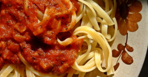 Tomato sauce over fettucine noodles