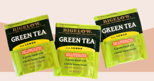 Three green-hued bags of Bigelow decaffeinated green tea with lemon